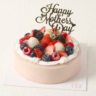 Elegant pink Maman cake with Mother's Day topper. 