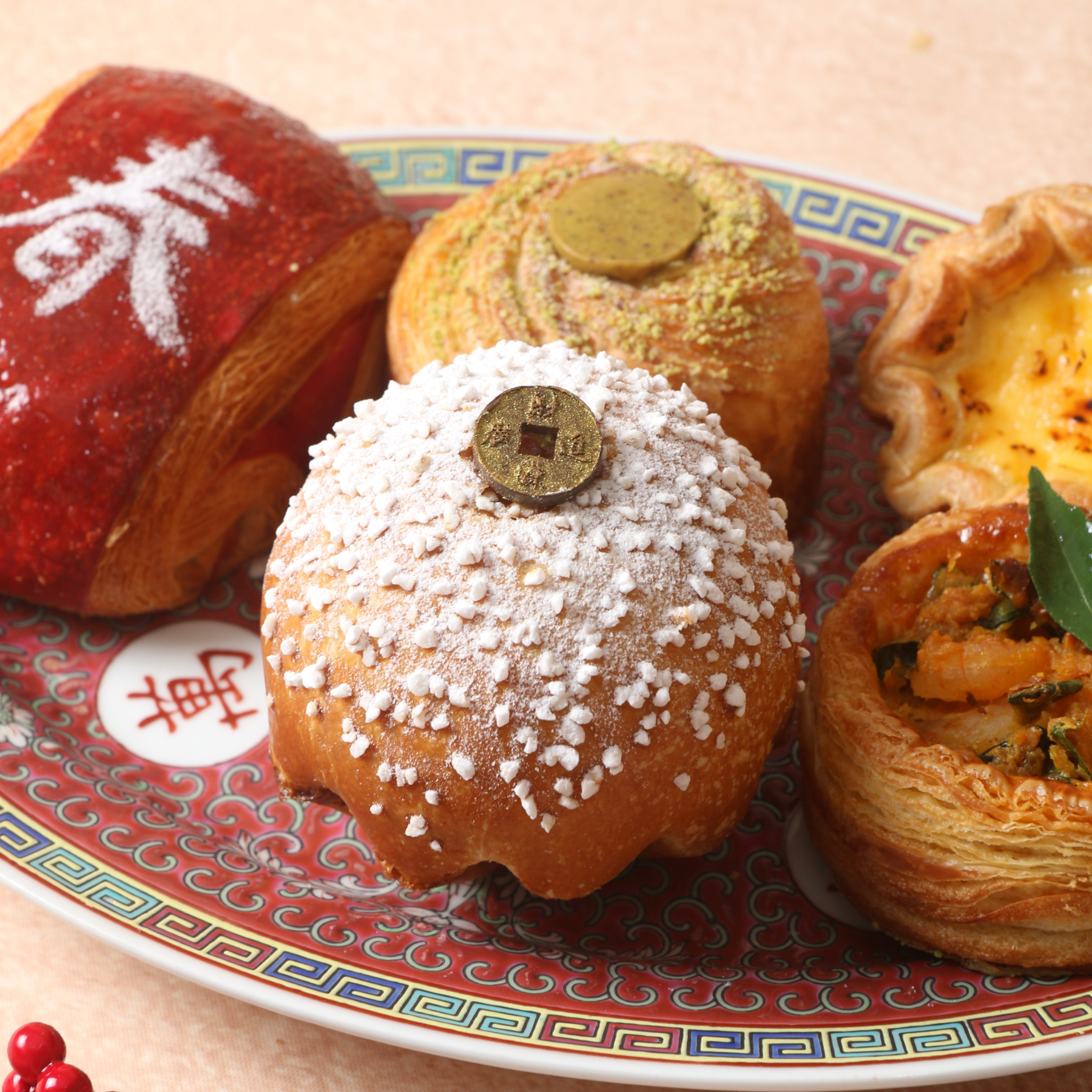 cny pastry detail from Golden Blessings Pastry Gift Box: powdered brioche, pistachio cruffin, egg tart.