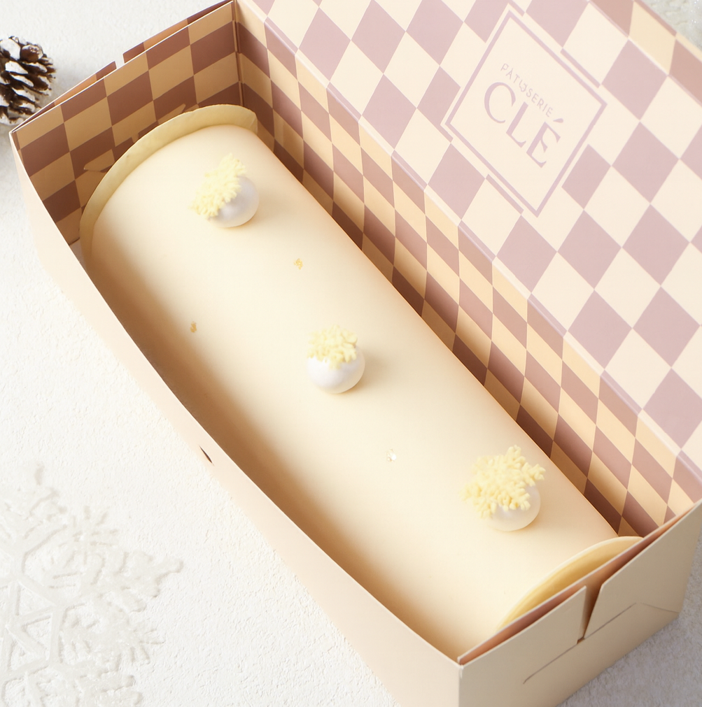 Hazelnut Praline Log Cake - the whole cake in the box image